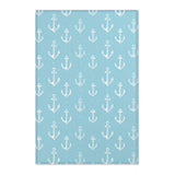 Nautical anchor nursery area rug in a coastal baby room