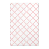 Pink trellis nursery area rug in a baby girl's bedroom