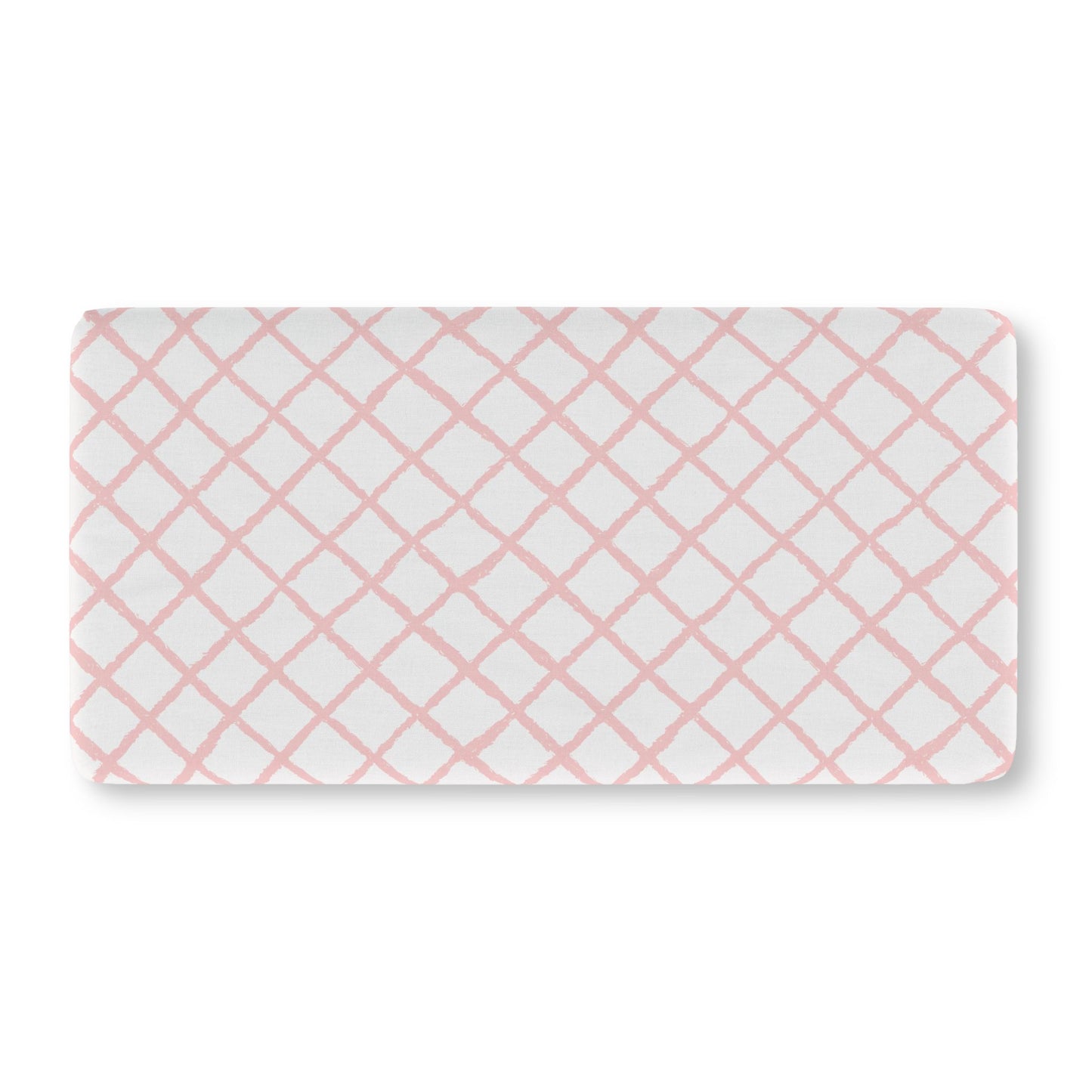 Soft pink lattice crib sheet showing the fitted elasticated corner