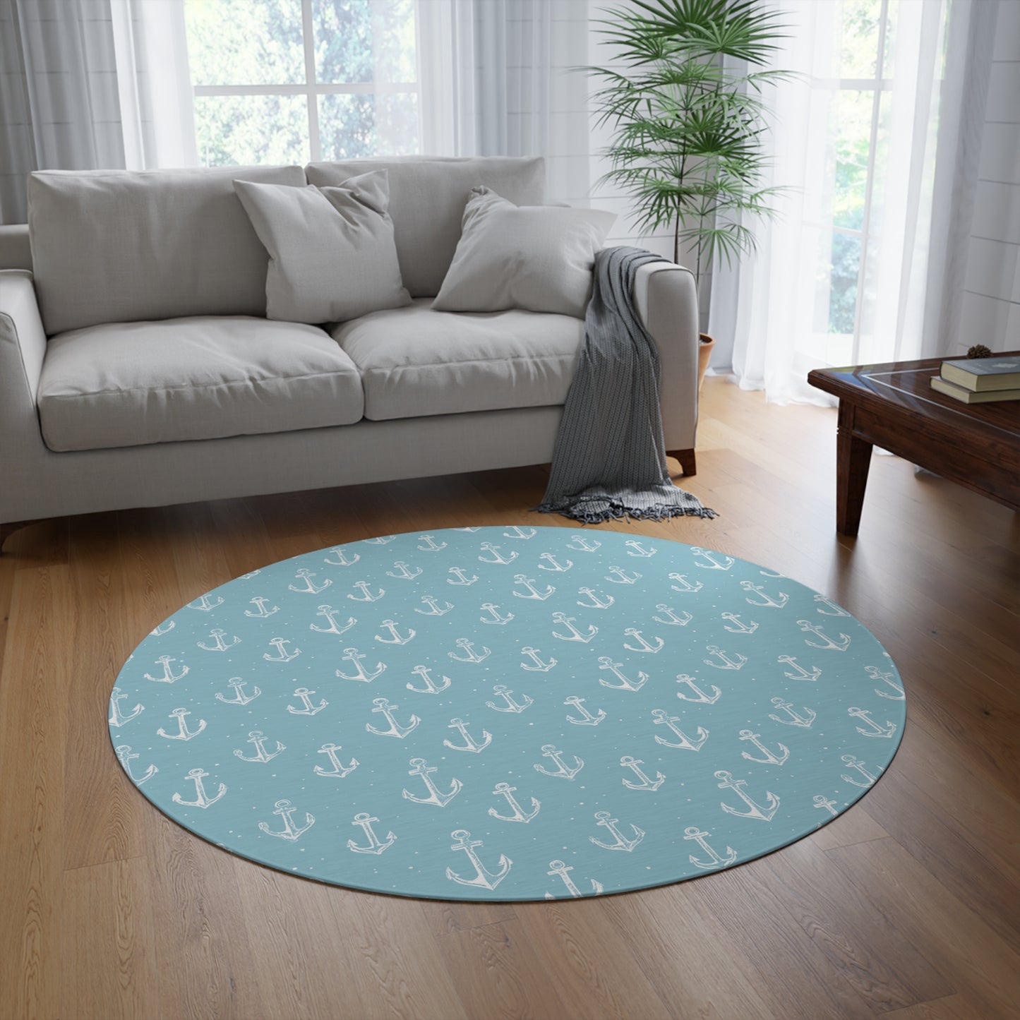 Nautical anchor round rug styled under a nursery crib