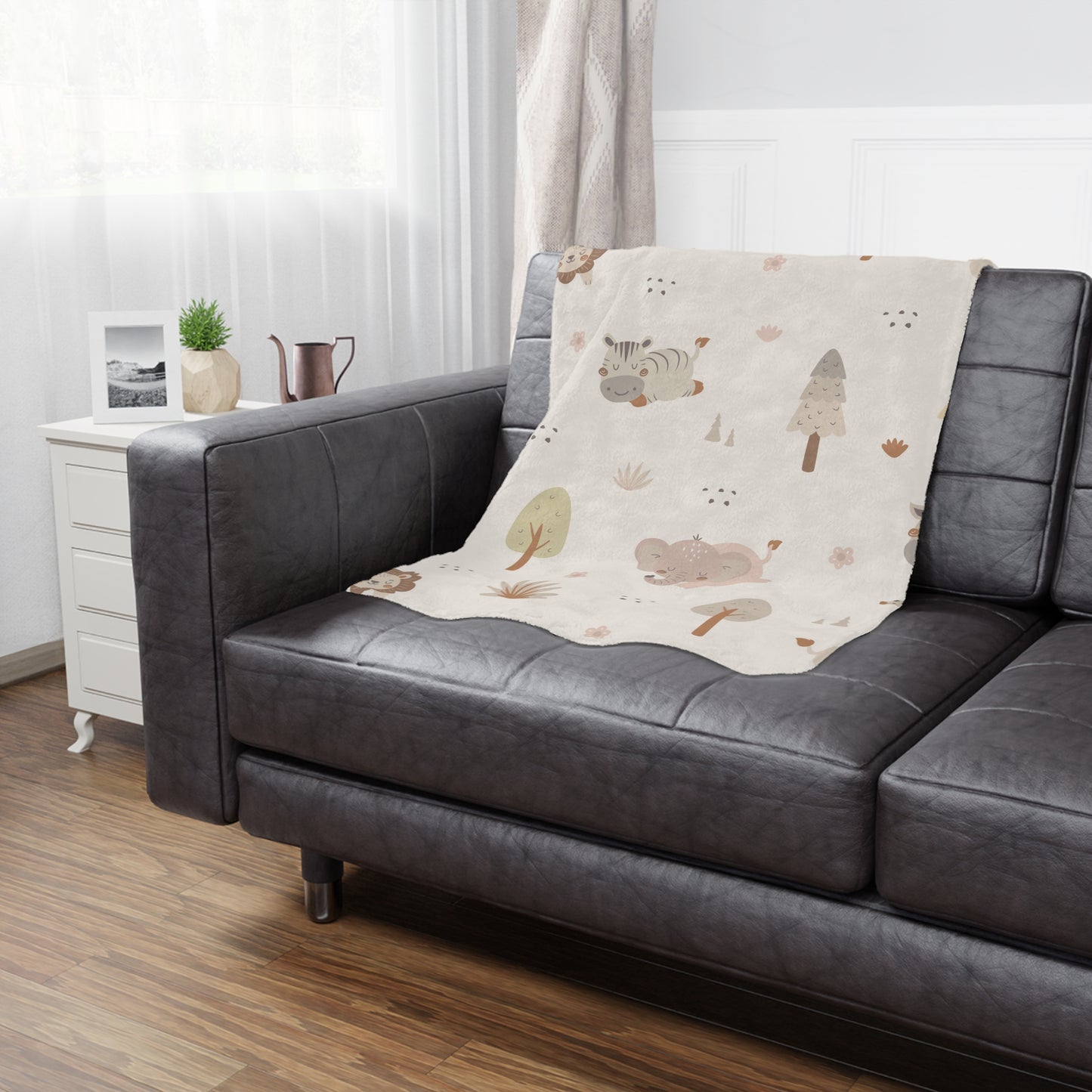 Sleepy safari baby blanket styled in a nursery