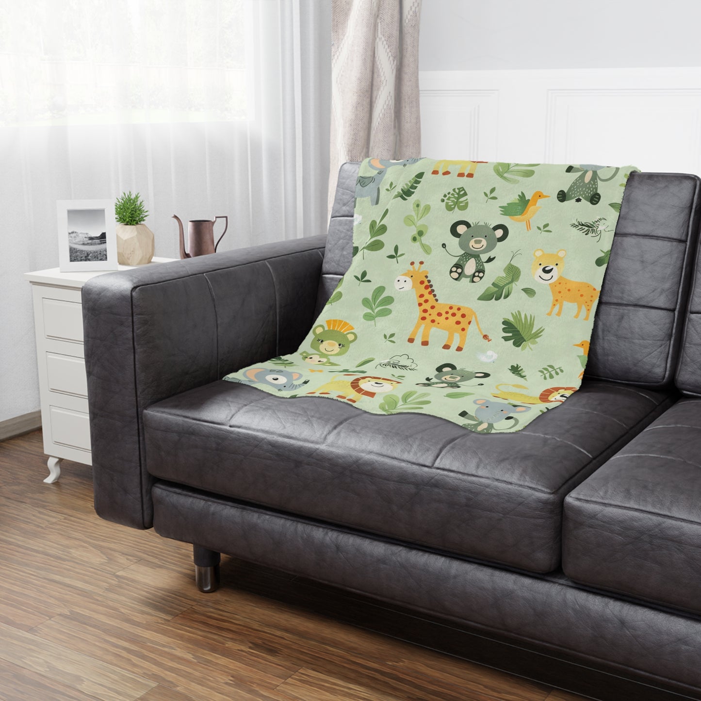 Jungle animal baby blanket styled in a nursery