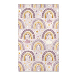 Purple rainbow nursery area rug with gold banding on lilac