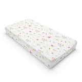 Blush Blossom changing pad cover on a nursery changing table
