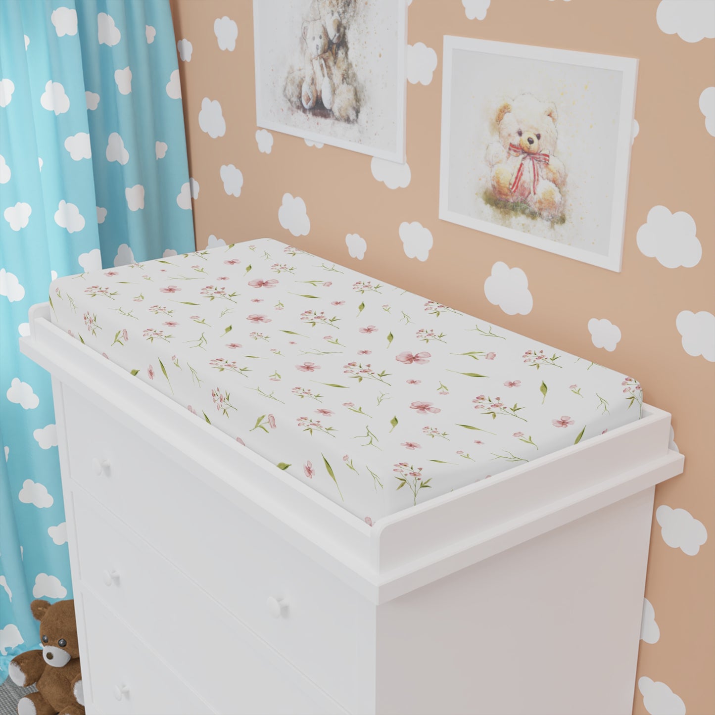 Pink floral changing pad cover matching the nursery crib sheet