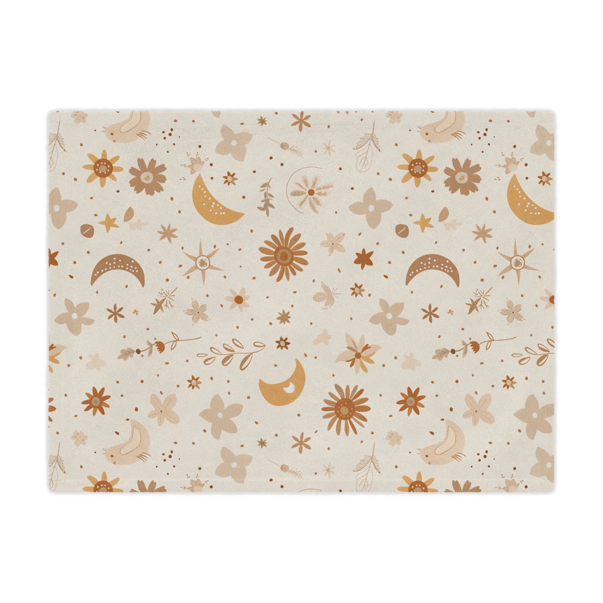 Close detail of the moon and daisy print on the minky blanket
