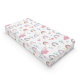 Confetti Rainbows changing pad cover on a nursery changing table