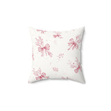 Crimson Bow decorative nursery pillow on a glider chair