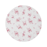 Crimson Bow round nursery rug on a baby room floor