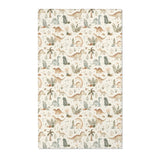 Dinosaur nursery area rug in sage and tan on cream