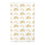 Gold rainbow nursery area rug on a white ground