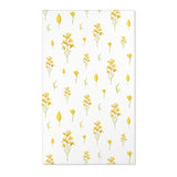 Mustard yellow floral nursery area rug on pale linen