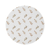 Linen Leaf round nursery rug on a baby room floor