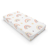 Peach Rainbow changing pad cover on a nursery changing table