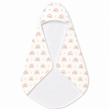 Peach Rainbow hooded baby towel wrapped around a baby