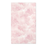 Rectangular pink cloud print nursery rug shown from above