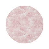 Pink watercolor clouds round nursery rug on a baby girl's bedroom floor