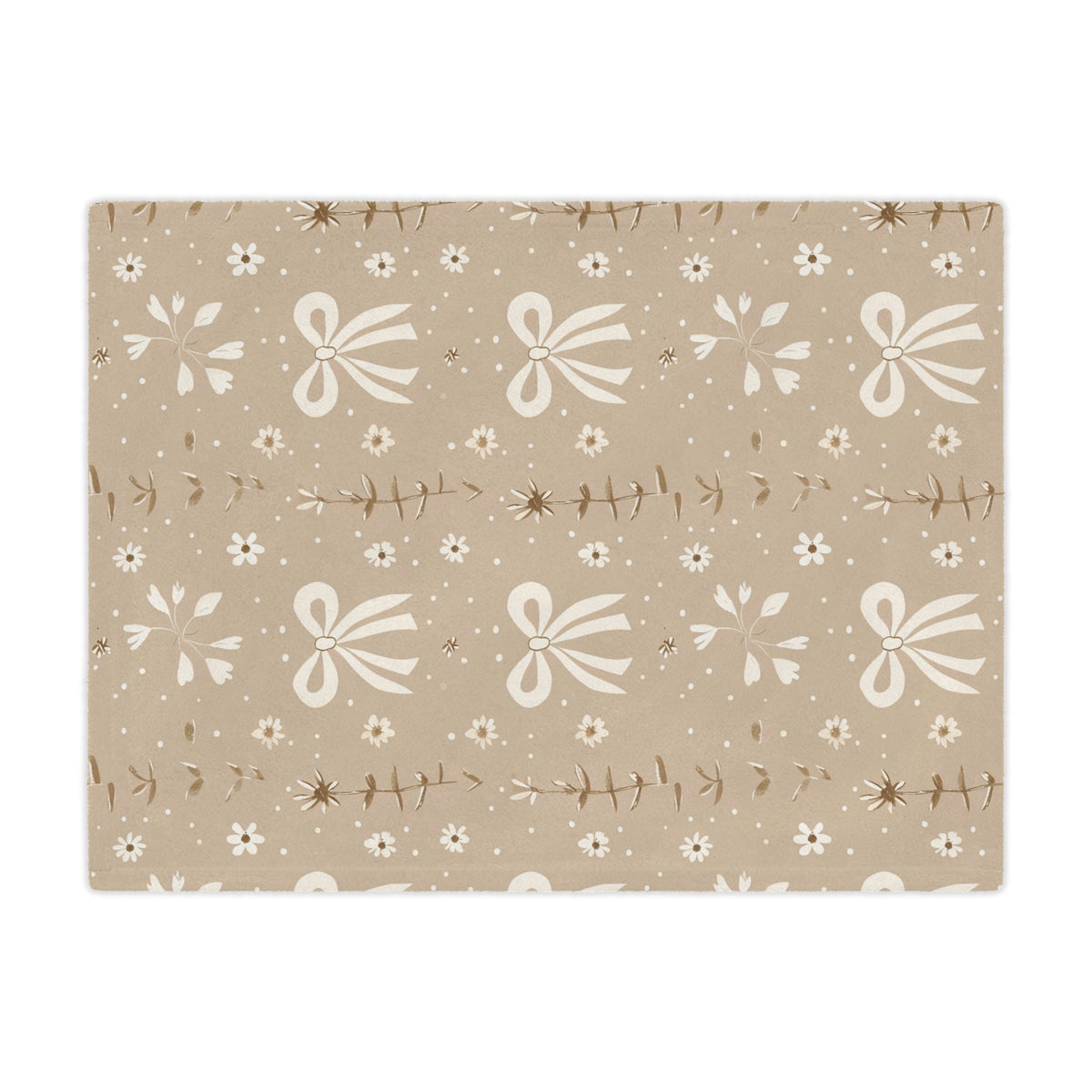 Close detail of the bow and daisy print on the minky blanket
