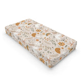 Wildflower Rainbow changing pad cover on a nursery changing table