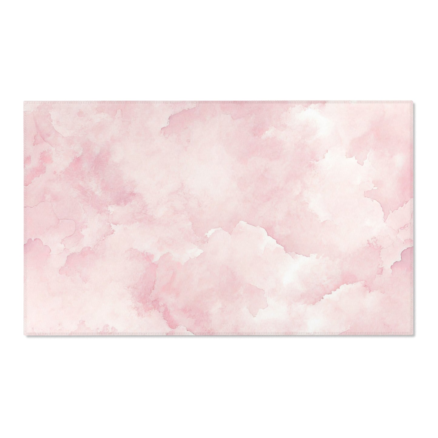 Pink cloud print area rug defining a nursery play area