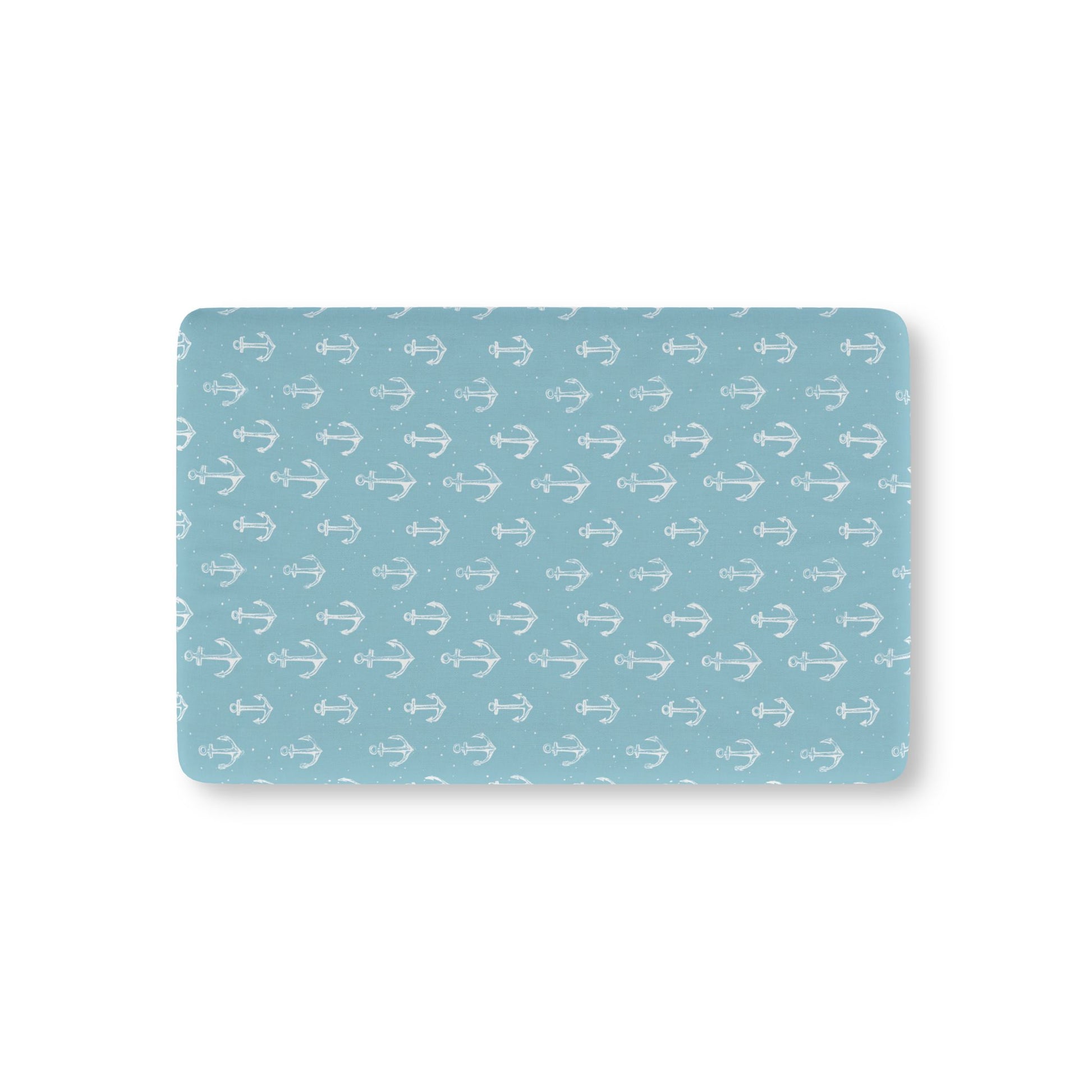 Nautical anchor fitted crib sheet on a nursery crib mattress