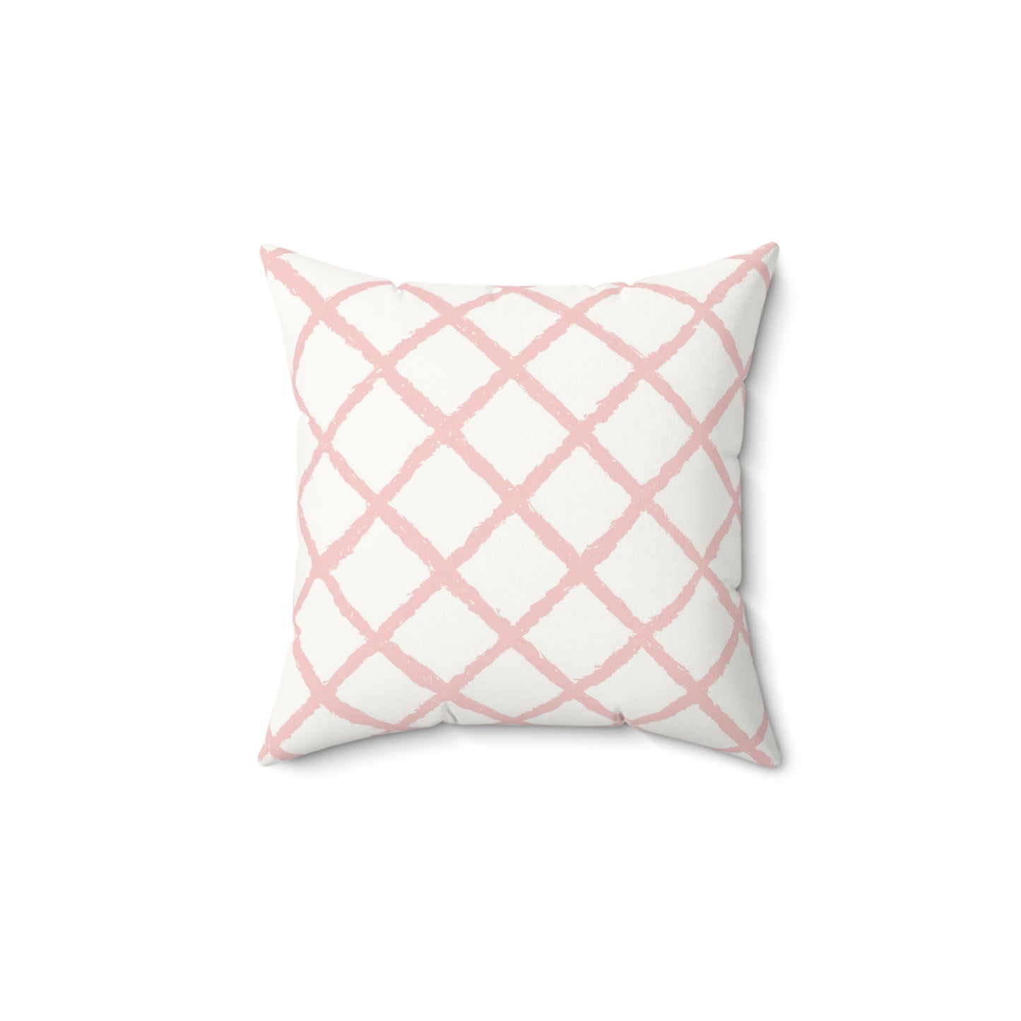 Pink trellis decorative nursery pillow on a glider chair