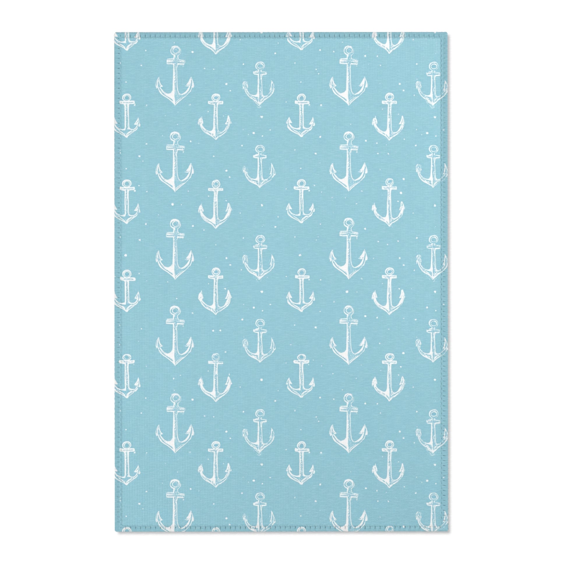 Nautical anchor nursery area rug in a coastal baby room