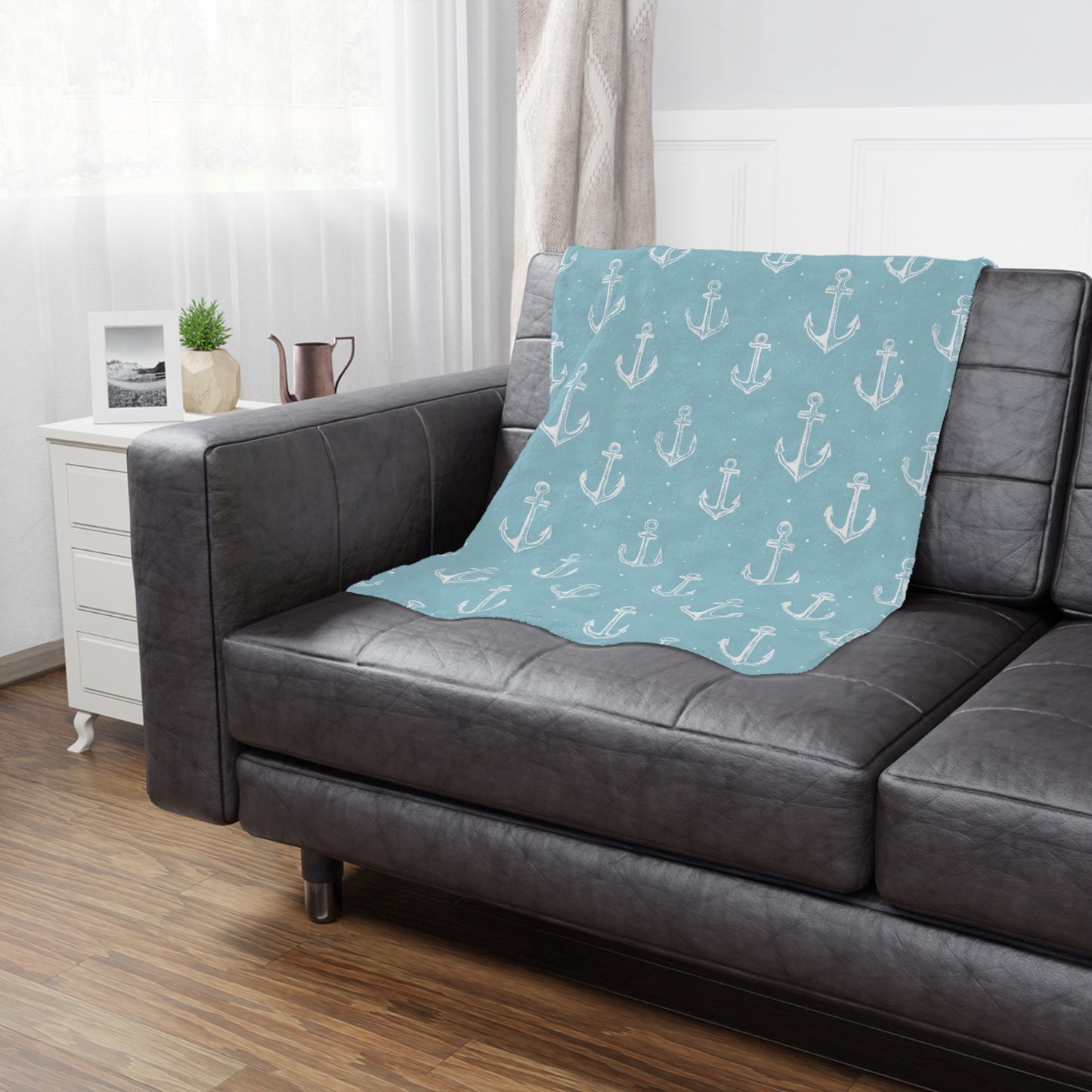Nautical anchor baby blanket styled in a nursery