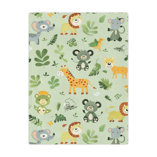 Jungle animal minky baby blanket draped over a crib