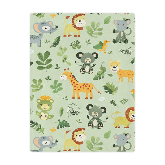 Jungle animal minky baby blanket draped over a crib