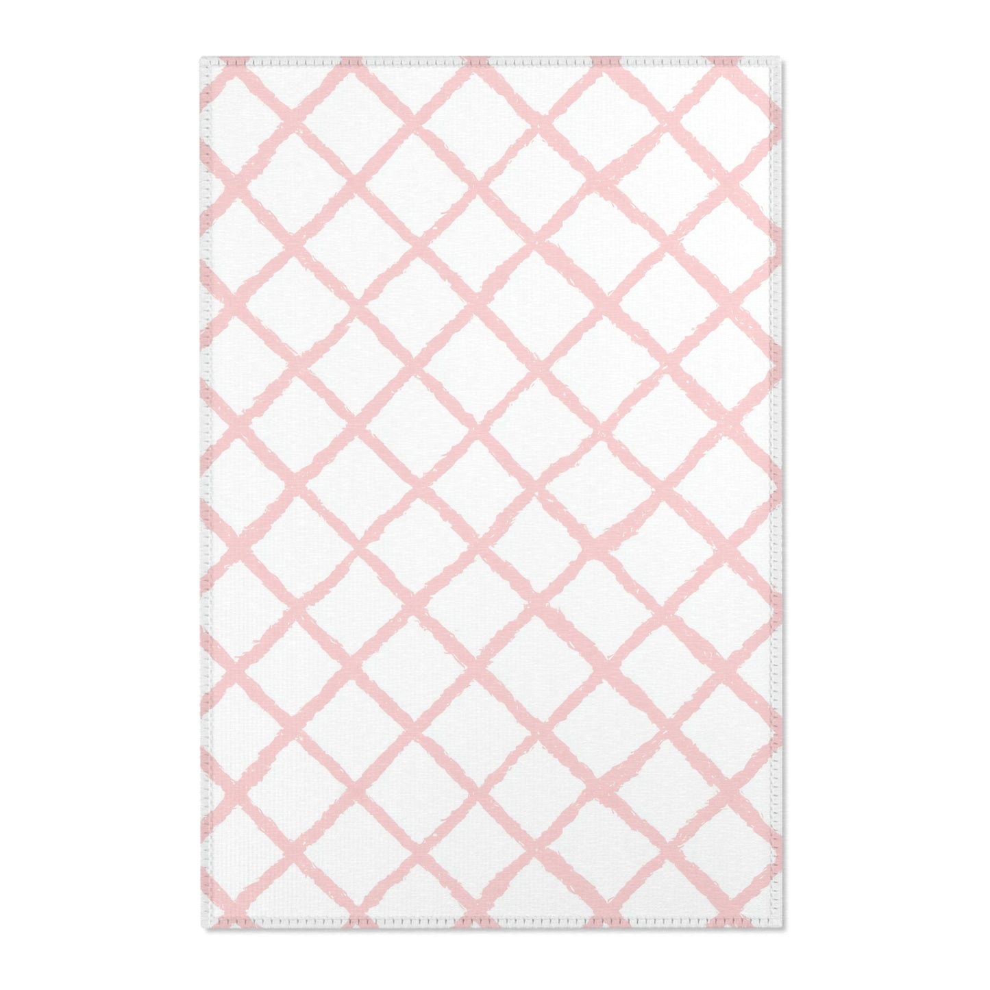 Pink trellis nursery area rug in a baby girl's bedroom