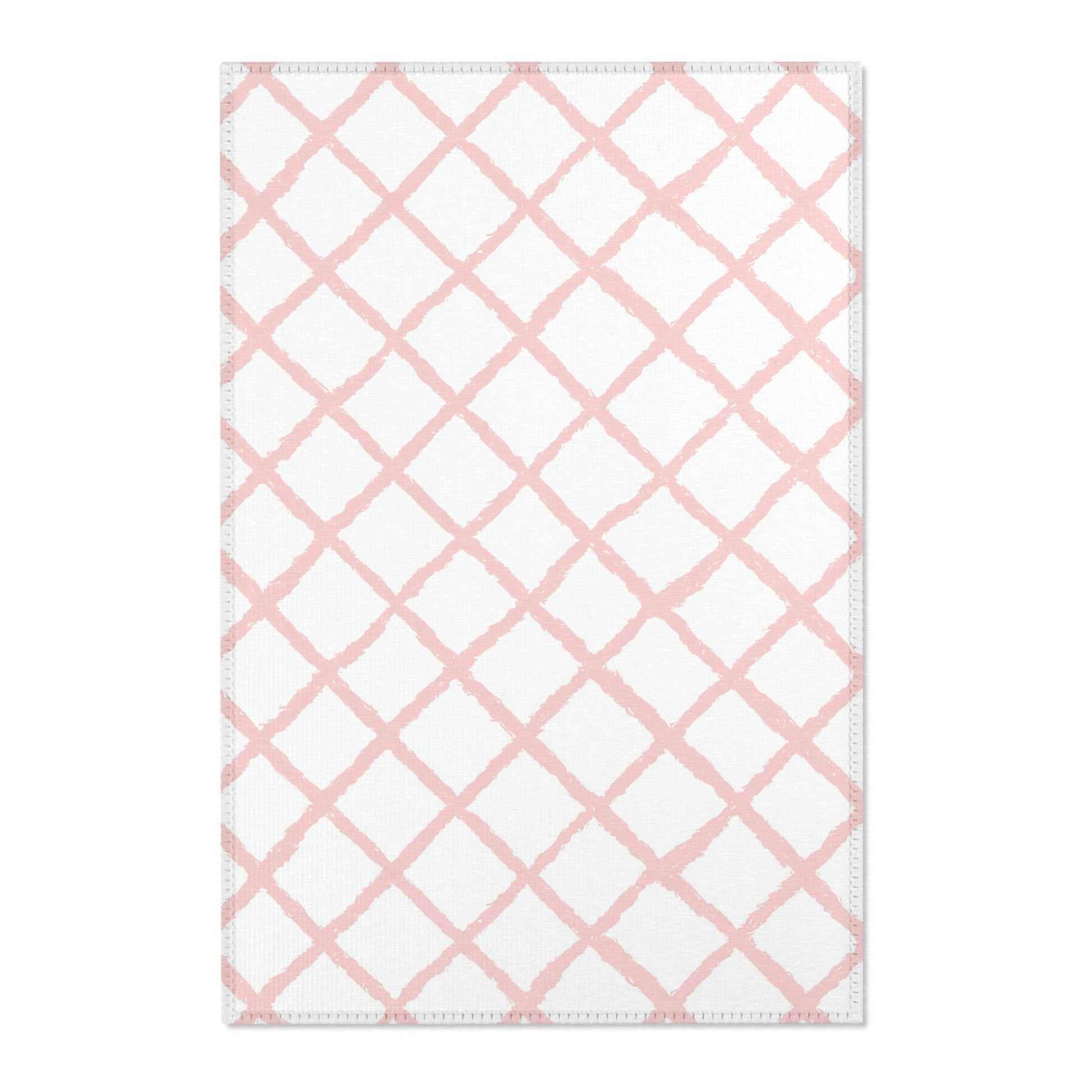 Pink trellis nursery area rug in a baby girl's bedroom