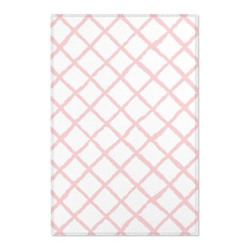 Pink trellis nursery area rug in a baby girl's bedroom