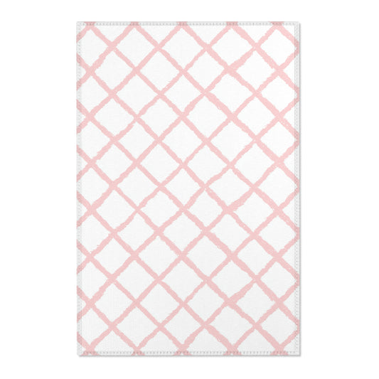 Pink trellis nursery area rug in a baby girl's bedroom