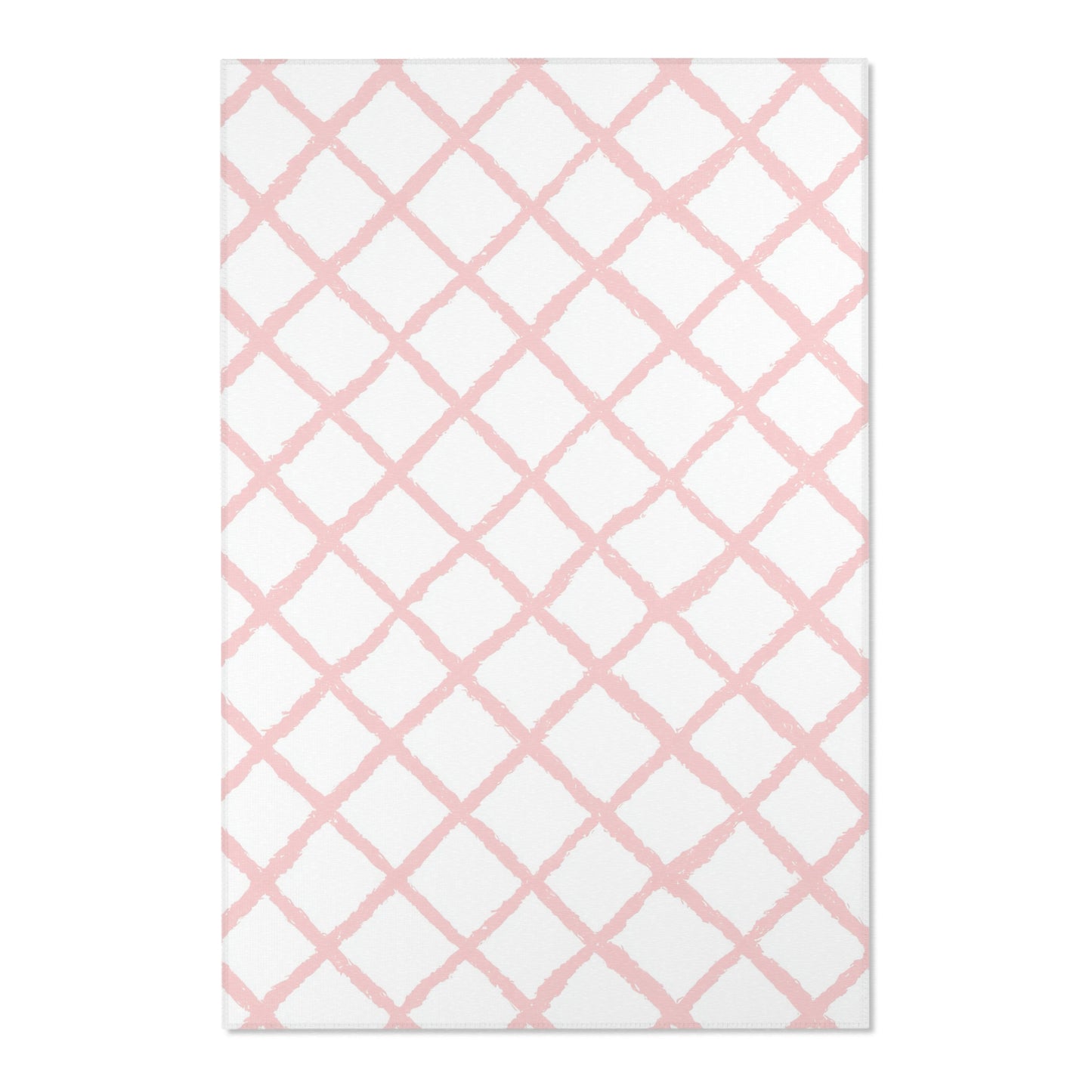 Close-up of the hand-painted pink trellis print on a nursery rug