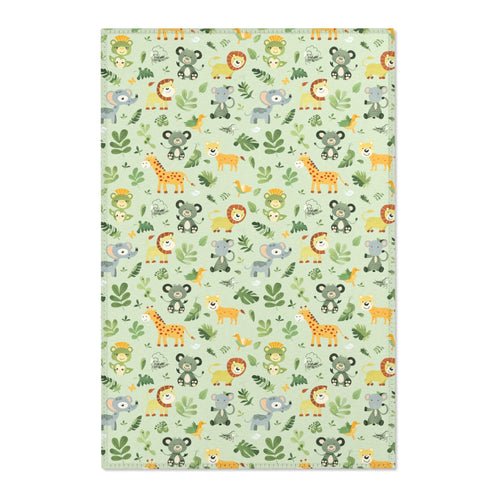 Jungle animal nursery area rug in a sage green baby room