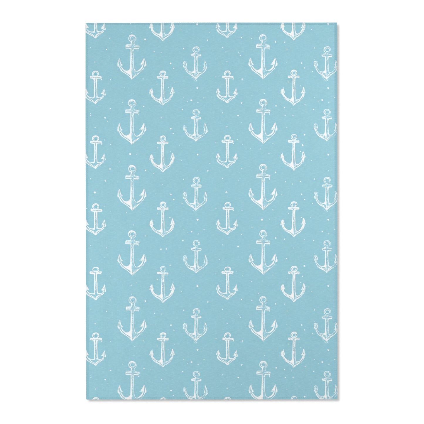 Close-up of the hand-drawn anchor print on a nursery rug