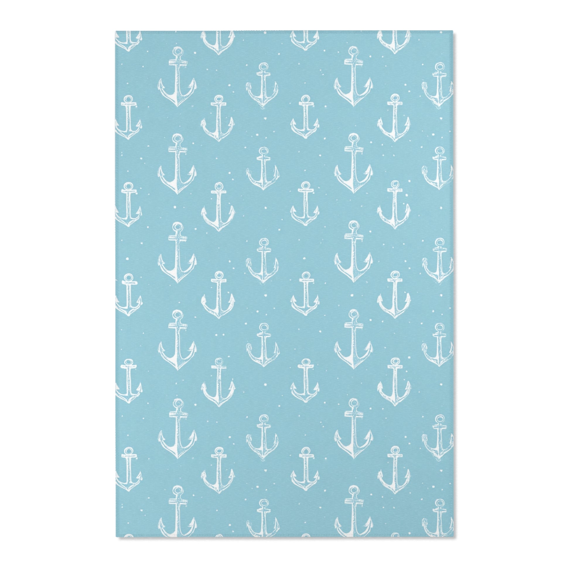 Close-up of the hand-drawn anchor print on a nursery rug