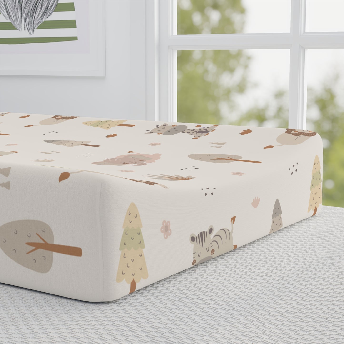 Close-up of the sleeping animal print on a changing pad cover