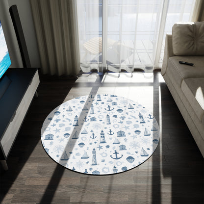 Close-up of the lighthouse and sailboat print on a round nursery rug