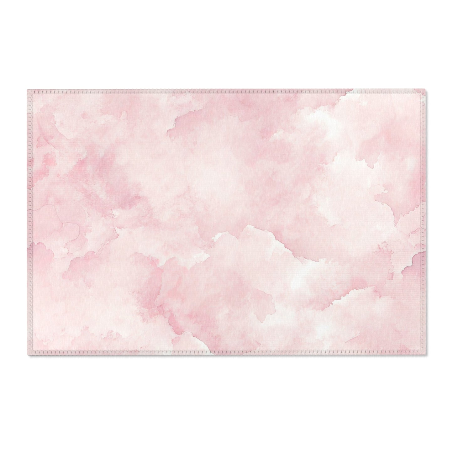 Washable pink watercolor clouds area rug under a nursery crib
