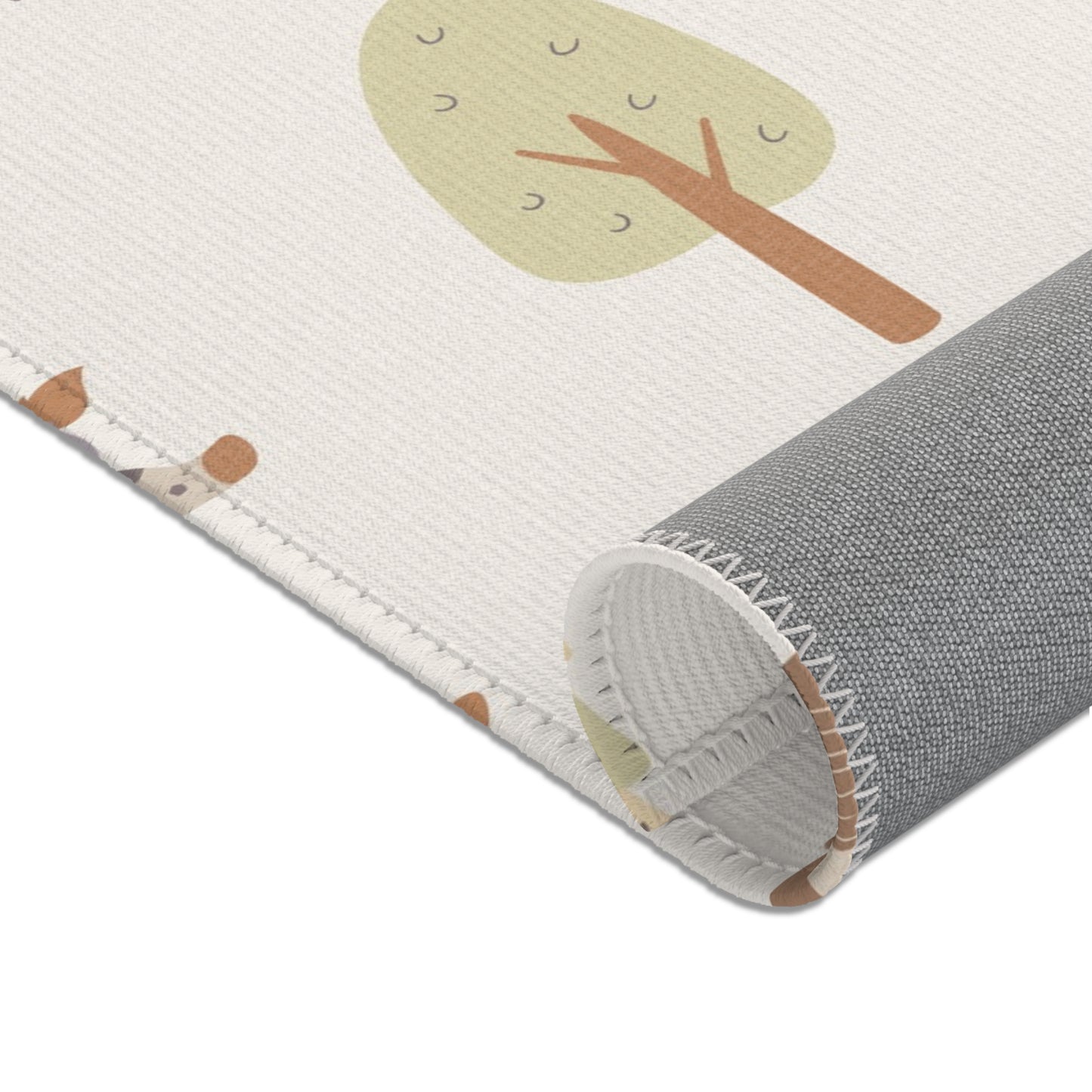 Cream safari print baby room rug in a styled nursery