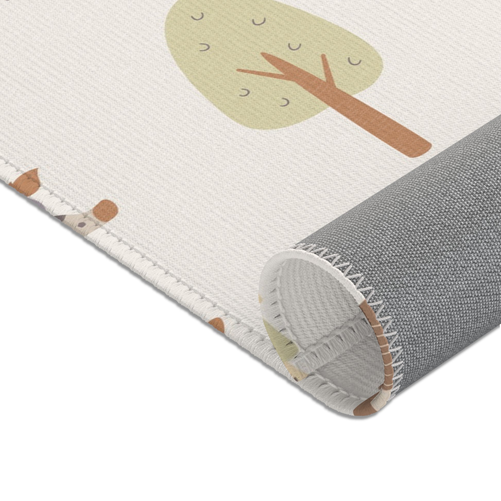 Cream safari print baby room rug in a styled nursery