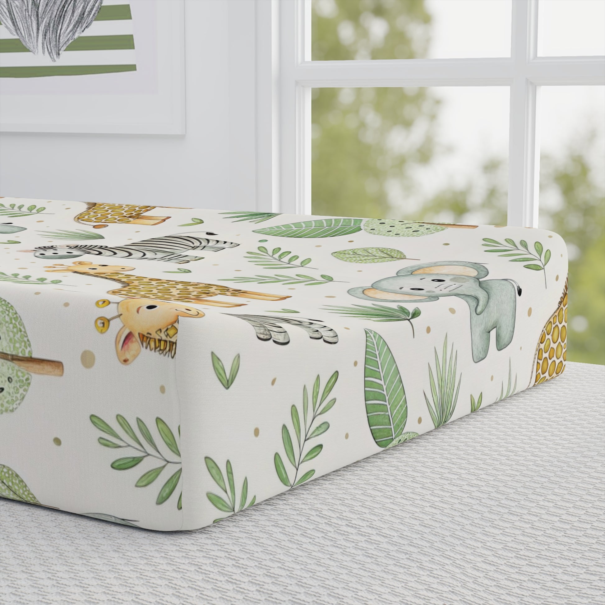 Close-up of the safari print on a nursery changing pad cover