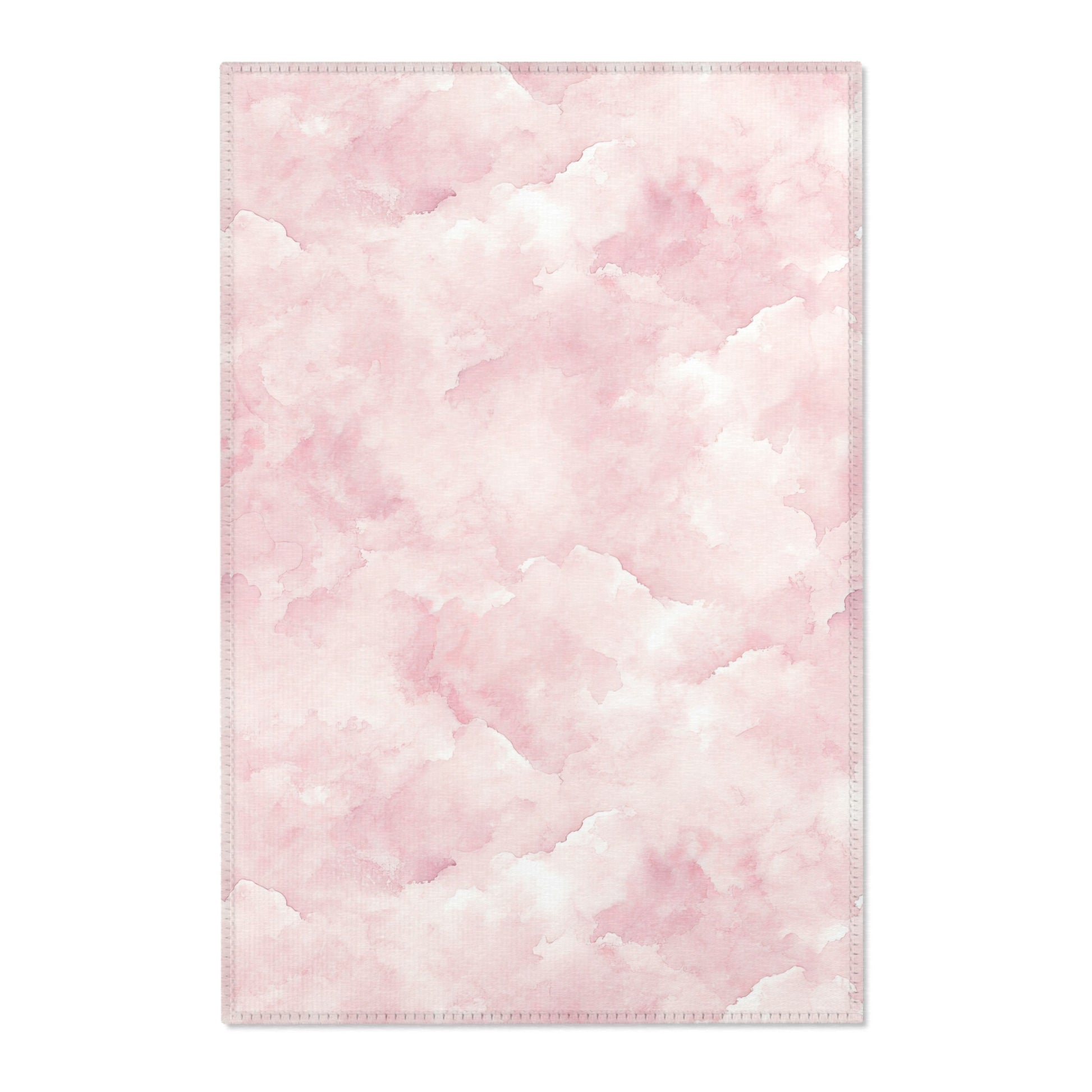 Pink watercolor clouds nursery area rug in a baby girl's bedroom
