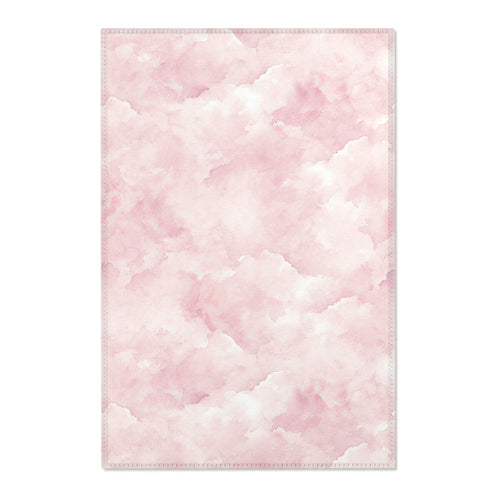 Pink watercolor clouds nursery area rug in a baby girl's bedroom