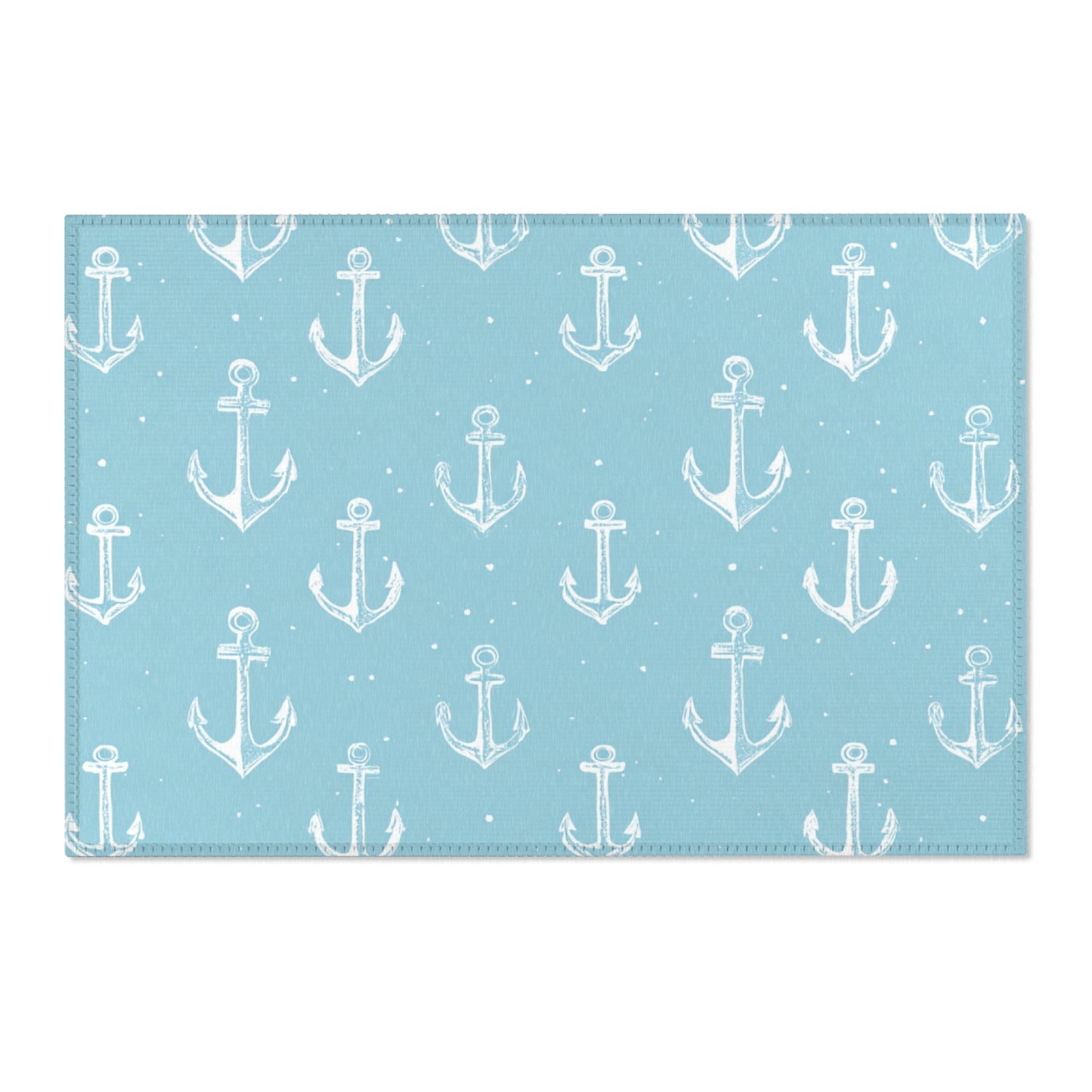Washable nautical anchor area rug under a nursery crib