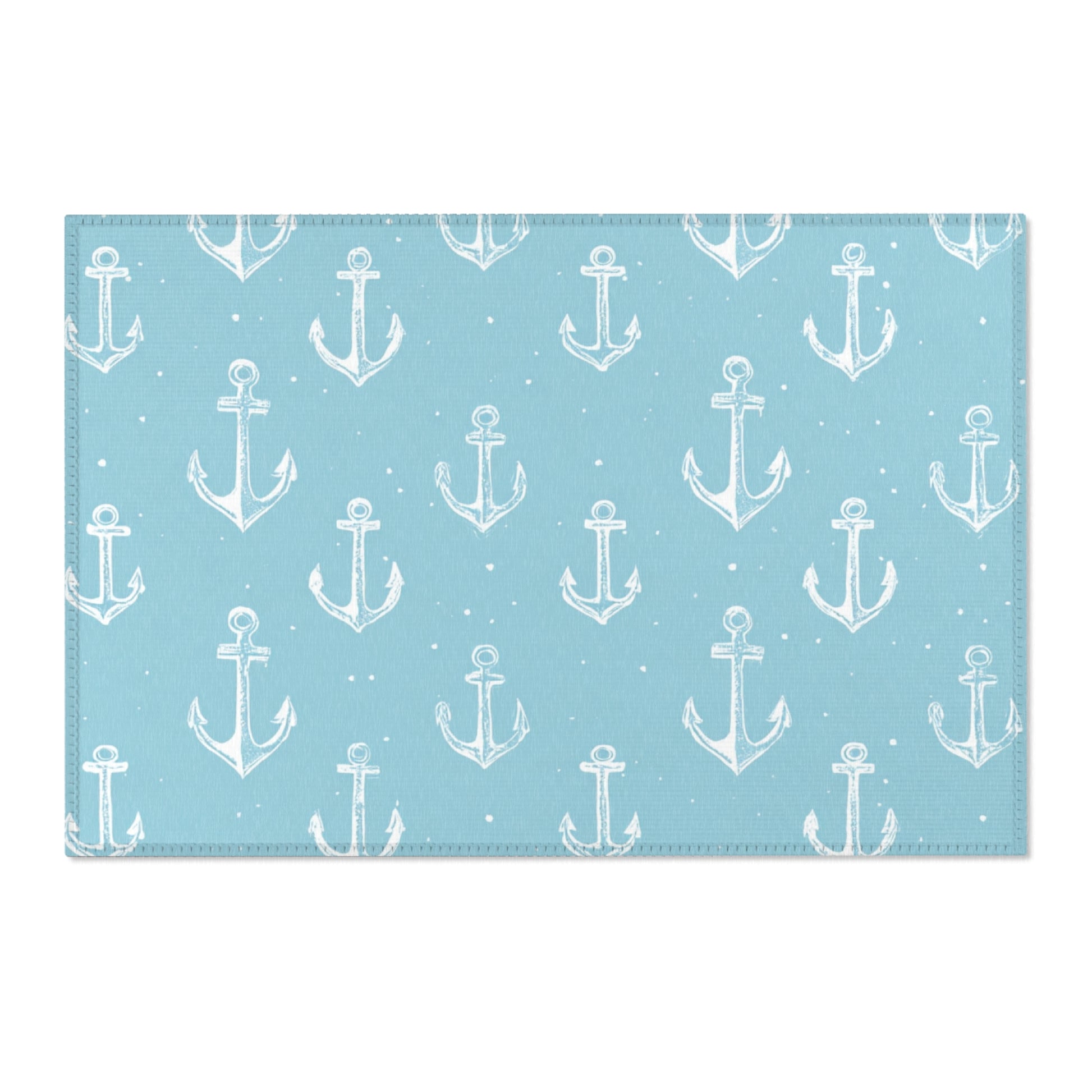 Washable nautical anchor area rug under a nursery crib