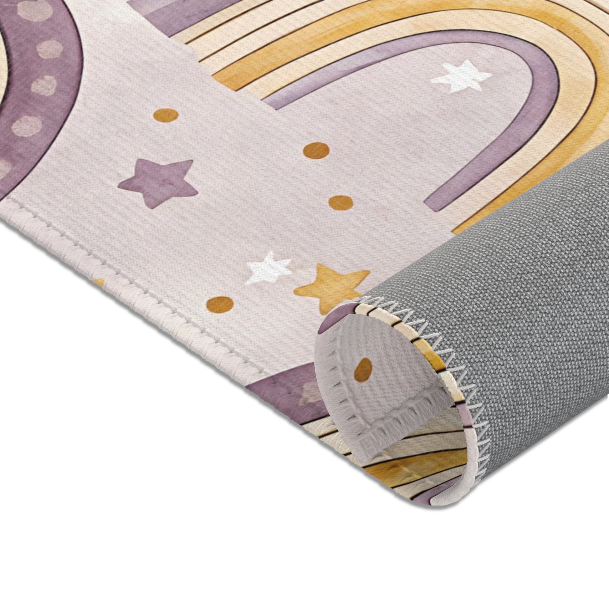 Large arches, clouds and gold stars across the nursery area rug