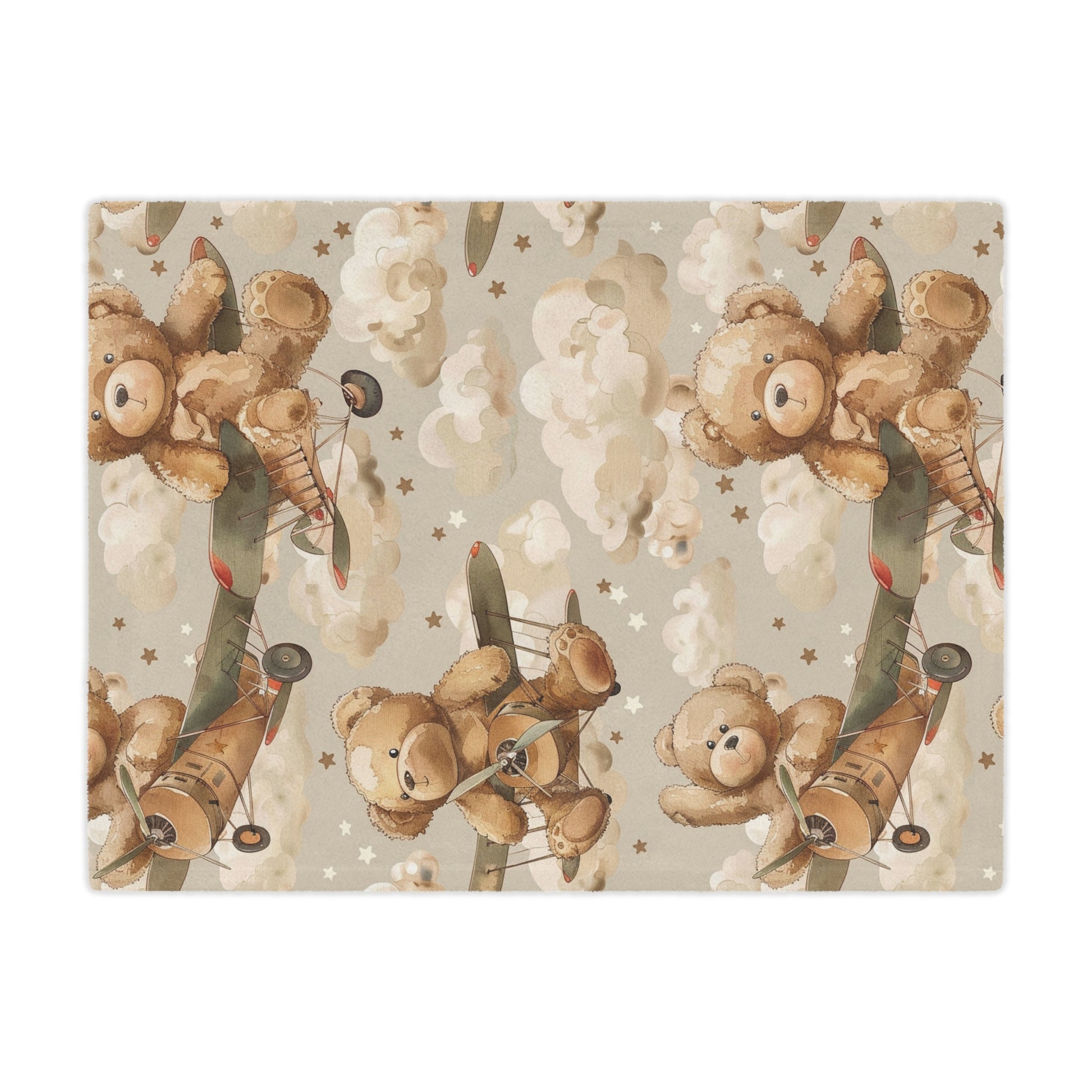 Close detail of a teddy bear flying a biplane on the minky blanket